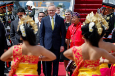 Australia's Prime Minister Anthony Albanese arrives at Ngurah Rai International airport in Denpasar, Bali on November 14, 2022. The 17th Group of Twenty (G20) Heads of State and Government Summit will be held in Bali from 15 to 16 November 2022.
