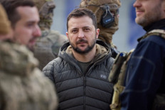 This handout photograph taken and released by Ukrainian Presidential press service on November 14, 2022, shows Ukrainian President Volodymyr Zelensky looking on during his visit to the newly liberated city of Kherson, following the retreat of Russian forces from the strategic hub. 
