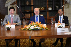 US President Joe Biden (center), Britain Prime Minister Rishi Sunak (right) and Canada's Prime Minister Justin Trudeau gather to hold an “emergency“ meeting to discuss a missile strike on Polish territory near the border with Ukraine, on the side line of the G20 leaders' summit in Nusa Dua, Bali on November 16, 2022. 

