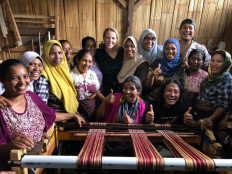 For love of Indonesia: Kopernik cofounder and chief operating officer Ewa Wojkowska (center rear, in black top) is pictured with a group of ergonomic weavers in Lembata, East Nusa Tenggara. 