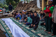 Villagers offer prayers at a funeral following a 5.6-magnitude earthquake that struck Cianjur, West Java, on Nov. 22.