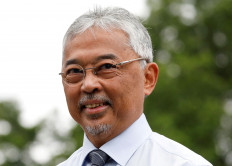 Malaysian King Sultan Abdullah Sultan Ahmad Shah smiles outside the National Palace in Kuala Lumpur, Malaysia. Nov. 21, 2022.