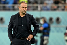 Germany's coach Hans-Dieter Flick watches his players from the touchline during the Qatar 2022 World Cup Group E football match between Germany and Japan at the Khalifa International Stadium in Doha on November 23, 2022. 

