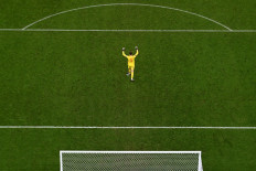 Belgium's goalkeeper #01 Thibaut Courtois celebrates at the end of the Qatar 2022 World Cup Group F football match between Belgium and Canada at the Ahmad Bin Ali Stadium in Al-Rayyan, west of Doha on November 23, 2022. 
