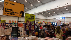 Genres galore: A sign for books in the crime, thriller and mystery genres stands above neatly stacked books at the Big Bad Wolf Book Sale, which runs from Nov. 25 to Dec. 5 at the Indonesia Convention Exhibition (ICE) in BSD City, South Tangerang. (JP/Radhiyya Indra)