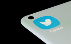 Latest on Twitter: The Twitter app is seen on a smartphone in this illustration taken on July 13, 2021. The bird app plans to roll out its verified service next Friday with different colored checks for individuals, companies and governments. Longer explanations are expected this week, according to chief executive Elon Musk.