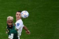 Cameroon's forward #13 Eric Maxim Choupo-Moting (left) and Serbia's midfielder #06 Nemanja Maksimovic head the ball during the Qatar 2022 World Cup Group G football match between Cameroon and Serbia at the Al-Janoub Stadium in Al-Wakrah, south of Doha on November 28, 2022. 
