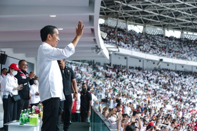 President Joko “Jokowi“ Widodo waves to his supporters during a mass rally at the Gelora Bung Karno stadium on Saturday.