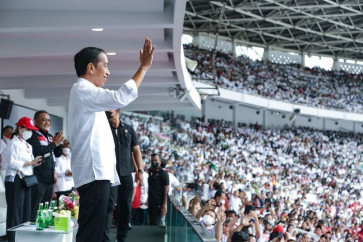 President Joko “Jokowi” Widodo waves to his supporters at a mass rally on Nov. 11, 2021 at Gelora Bung Karno Stadium.