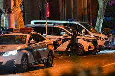Police cars are seen on a street near to Wulumuqi road, named for Urumqi in Mandarin, in Shanghai on November 28, 2022, a day after rare protests against China's zero-Covid policy, following a deadly fire in Urumqi, the capital of the Xinjiang region. Hundreds of people have taken to the streets in China's major cities in a rare outpouring of public anger against the state over its zero-Covid policy. 

