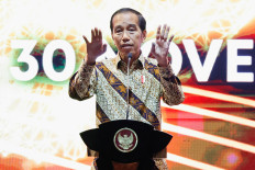 President Joko "Jokowi" Widodo gestures as he delivers his remarks during the annual meeting of Bank Indonesia with its financial stakeholders in Jakarta on Nov. 30, 2022. 
