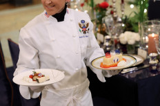 White House Executive Pastry Chef Susie Morrison shows off a cheese and dessert plate during a media preview for the upcoming State Dinner for French President Macron, at the White House on November 30, 2022 in Washington, DC. 