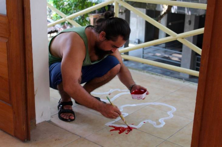 Art in the making: Chopan during the preparation of his group exhibition, Everything is Controversial: Death of Contemporary Art, at Studio Kalahan, Yogyakarta, in 2016, along with Amin Taasha and T-KA T-KI (Trinodal Group). (Courtesy Mumtaz Khan Chopan)