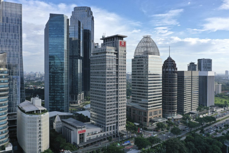 High-rise buildings are seen in the Sudirman central business district of Jakarta on March 14, 2021.