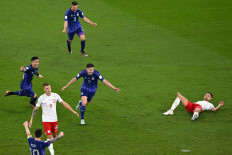 Argentina's forward #09 Julian Alvarez (center) celebrates scoring his team's second goal during the Qatar 2022 World Cup Group C football match between Poland and Argentina at Stadium 974 in Doha on November 30, 2022. 
