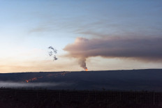 Mauna Loa, the world's largest volcano, erupts for the first time since 1984 near Hilo, Hawaii, on December 3, 2022. The world's largest active volcano burst into life for the first time in 40 years, spewing lava and hot ash since November 28, 2022, in a spectacular display of nature's fury by Mauna Loa in Hawaii. Rivers of molten rock could be seen high up on the volcano, venting huge clouds of steam and smoke at the summit on Big Island, and sparking warnings the situation could change rapidly.
