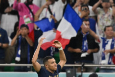 France's forward #10 Kylian Mbappe celebrates scoring his team's third goal during the Qatar 2022 World Cup round of 16 football match between France and Poland at the Al-Thumama Stadium in Doha on December 4, 2022. 
