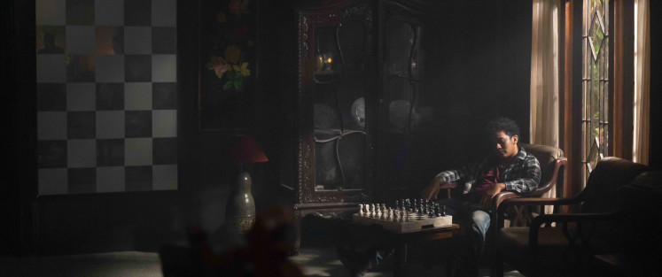Picture perfect: Chess imagery frequently emerges in Makbul Mubarak's feature debut “Autobiography”. Polish cinematographer Wojciech Staroń does his magic with the camera. (Courtesy of KawanKawan Media)
