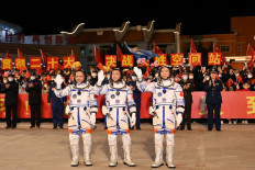 (From right) Chinese astronauts Fei Junlong, Deng Qingming and Zhang Lu, crew of the Shenzhou-15 spaceflight mission, wave during a ceremony prior to the launch of the Shenzhou-15 mission at the Jiuquan Satellite Launch Center in Northwest China’s Gansu Province on November 29, 2022. China launched the Shenzhou-15 spacecraft on November 29, 2022 carrying three astronauts to its space station, where they will complete the country's first-ever crew handover in orbit, state news agency Xinhua reported.
