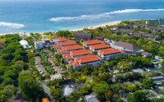 An undated illustration photo shows hotels near a beach in Bali.