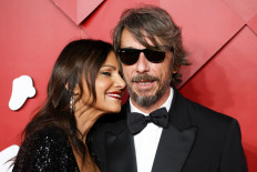 Designer Pierpaolo Piccioli and his wife Simona Caggia pose on the red carpet at the Fashion Awards 2022 in London, Britain, December 5, 2022. 
