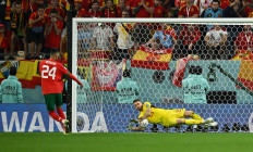 Morocco's Badr Benoun has his penalty saved by Spain's Unai Simon during the penalty shootout 