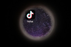 For the children: A smartphone displays the logo of Chinese social networking platform TikTok on Oct. 5, 2021. TikTok was hit on Wednesday with a pair of lawsuits from state of Indiana in the United States, alleging that the Chinese-owned app’s algorithms exposed inappropriate content to users as young as 13.