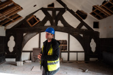 US film producer Hopwood DePree inspects the interior of Hopwood Hall, his family's ancestral home which dates from the 15th century, which he is in the process of restoring, in Middleton, northern England on November 28, 2022.