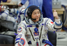 Moon calling: Japanese entrepreneur Yusaku Maezawa wears a space suit for the launch to the International Space Station (ISS) at Baikonur Cosmodrome, Kazakhstan, on Dec. 8, 2021. Maezawa on Friday announced that he plans to take K-Pop star TOP and DJ Steve Aoki on a trip around the moon next year on Elon Musk’s SpaceX rocket.