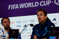 England's coach Gareth Southgate (left) and England's forward Harry Kane attend a press conference at the Qatar National Convention Center (QNCC) in Doha on December 9, 2022, on the eve of the Qatar 2022 World Cup quarter-final football match between England and France. 
