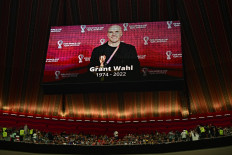 Tribute to Wahl: A giant screen on Saturday displays a photo of United States journalist Grant Wahl who died after he collapsed in the stadium's press area while covering the match between Argentina and Netherlands during the Qatar 2022 World Cup quarterfinal football match between England and France at the Al-Bayt Stadium in Al Khor, north of Doha. 