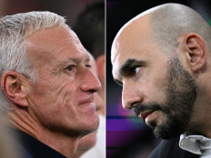 This combination picture created on December 12, 2022 during the Qatar 2022 World Cup football tournament shows France's coach Didier Deschamps (left) in Doha on December 4, 2022 and Morocco's coach Walid Regragui in Doha on December 6, 2022. France will play Morocco in the Qatar 2022 World Cup football semi-final match in Doha on December 14, 2022.
