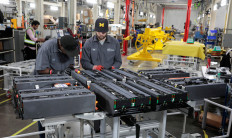 Canoo technicians work on battery packs for Canoo electric vehicles at a manufacturing site in Livonia, Michigan, US, November 29, 2022.