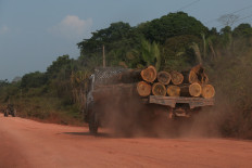A trucks drives carrying timber along the BR-230 (Transamazonica) highway in Manicoré, Amazonas state, Brazil on Sep. 22, 2022.