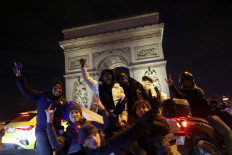 Jubilation on Paris Champs-Elysees after France reach World Cup final
