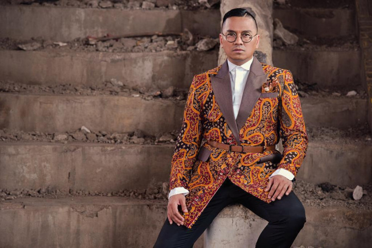 All occasions: Ai Syarif, chief creative of the Dan Liris Group, frequently wears outfits made of traditional fabrics for various events, including his business trips. (Courtesy of Ai Syarif)