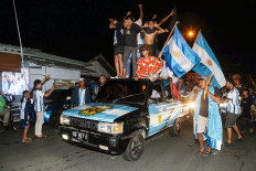 Argentina supporters watch the 2022 FIFA World Cup Qatar soccer final between Argentina and France, in Ternate, Maluku, on Dec. 18. 