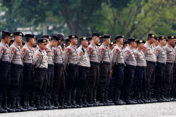 Police officers attend a ceremonial guard for Christmas and New Year at the National Monument (Monas) in Jakarta on Dec. 22, 2022.