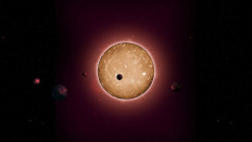 This artists rendering provided by Iowa State University in Ames, Iowa shows Kepler-444 a recently discovered star with at least five Earth-size planets. 