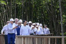 President Joko “Jokowi” Widodo (center) walks with United States President Joe Biden (left), Indian Prime Minister Narendra Modi (center) and other leaders through the Taman Hutan Raya Ngurah Rai Mangrove Forest on the sidelines of the Group of 20 Summit in Nusa Dua, Bali, on Nov. 16.
