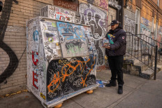 Danny Cortes, a street miniature artist, shows his miniature of an ice box in the Brooklyn borough of New York City on December 19, 2022. With his nimble fingers and child-like enthusiasm, Danny Cortes re-creates in miniature the hip-hop-infused street scenes of a gritty New York. But what began as a hobby has since brought him fame in the rap community and profitable sales even at Sotheby's prestigious auction house.
