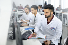 Students researching illustration. 