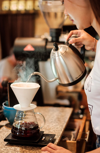 Coffee, anyone?: Barista Ni Putu Wiwik Octaviani brews hand-drip coffee. (Courtesy of Anggara Mahendra)