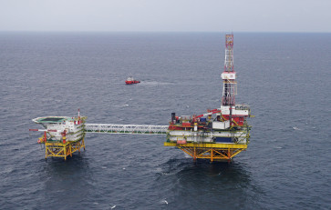 An oil platform operated by Lukoil company is pictured from a helicopter carrying members of a local election committee and journalists during the early voting for the parliamentary election, at the Kravtsovskoye oilfield in the Baltic Sea, Russia September 16, 2021.