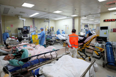 Medical workers attend to patients at the intensive care unit of the emergency department at Beijing Chaoyang hospital, amid the COVID-19 outbreak in Beijing, China on Dec. 27, 2022. 