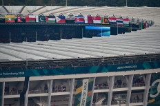 Flags of countries for the participants of the 2018 Asian Games decorate Bung Karno stadium in Senayan sport complex in Jakarta on August 18, 2018, prior to the opening ceremony. 

