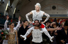 Designer Vivienne Westwood is carried after her catwalk show at London Fashion Week Men's in London, Britain June 12, 2017