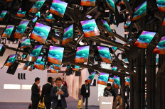 (FILES) In this file photo taken on January 7, 2020 Royole FlexPai foldable smartphones are displayed at the 2020 Consumer Electronics Show (CES) in Las Vegas, Nevada. The latest leaps in artificial intelligence in everything from cars, robots to appliances will be on full display at the annual Consumer Electronics Show (CES) opening on January 5, 2023 in Las Vegas. Forced by the pandemic to go virtual in 2021 and hybrid last year, tens of thousands of show-goers are hoping for a return to packed halls and rapid-fire deal-making that were long the hallmark of the annual gadget extravaganza.
