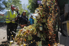 Municipal staff collects organic material which will be sent for a vermiculture recycling process, in the commune of La Pintana in Santiago, Chile, on November 23, 2022.