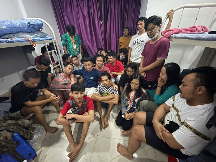 Wishing to come home: Migrant workers from Indonesia who fell victim to a job scam in Cambodia gather in a company dormitory in Sihanoukville City. (Kompas.id)

